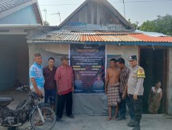 Bhabinkamtibmas Polsek Tanjung Raja Pasang Spanduk Himbauan Larangan Musik Remix di Desa Binaan